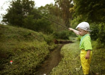 photo of little boy fishing